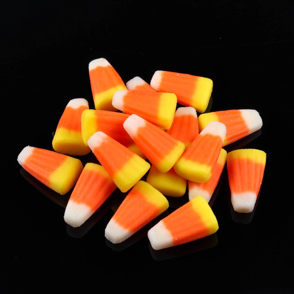 Candy corn pile on black background Candy corn pile on black background