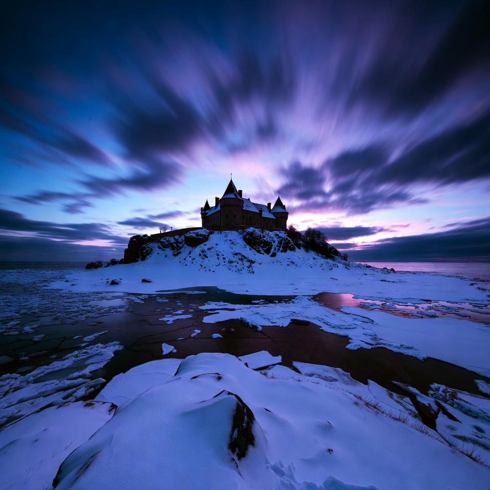 Castle on snowy island at twilight Castle on snowy island at twilight