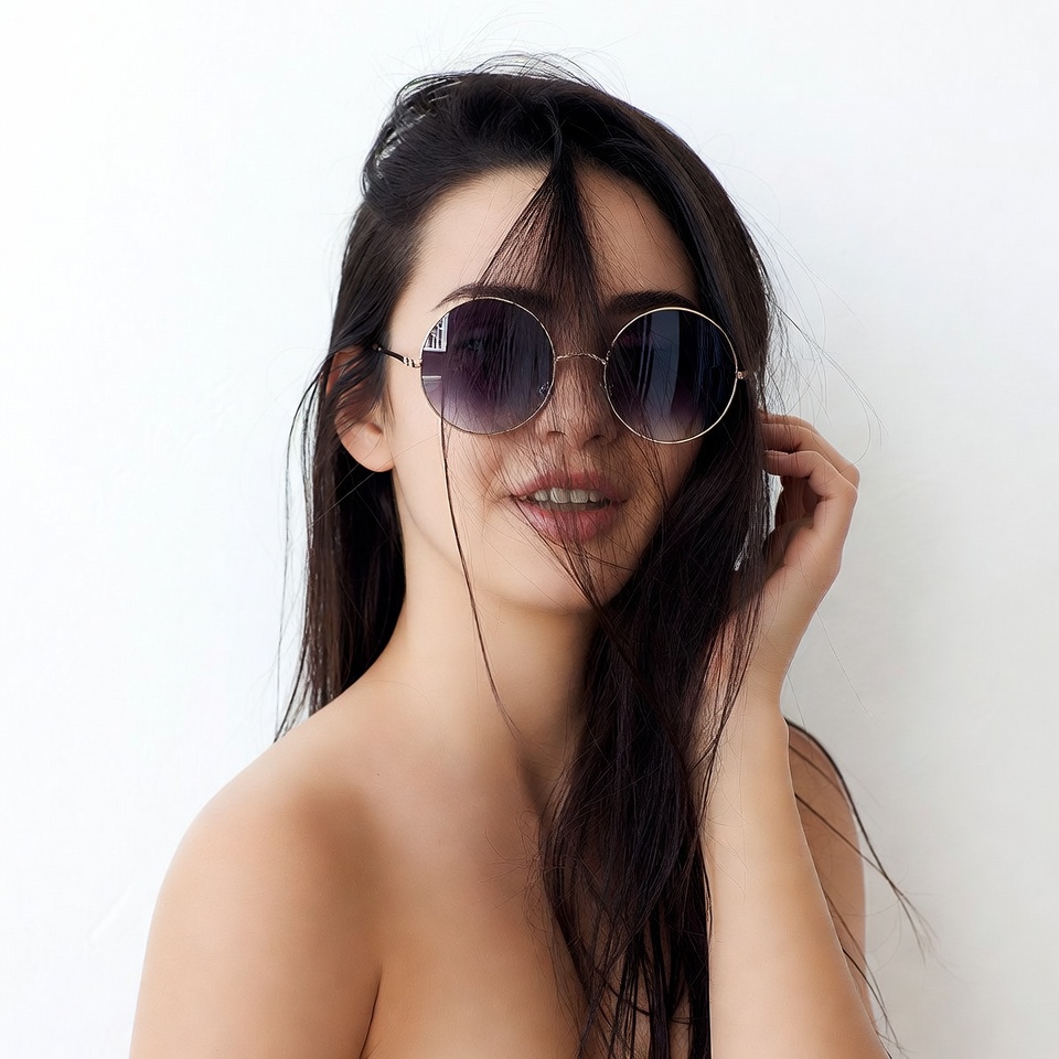 Woman in sunglasses with long hair Woman in sunglasses with long hair