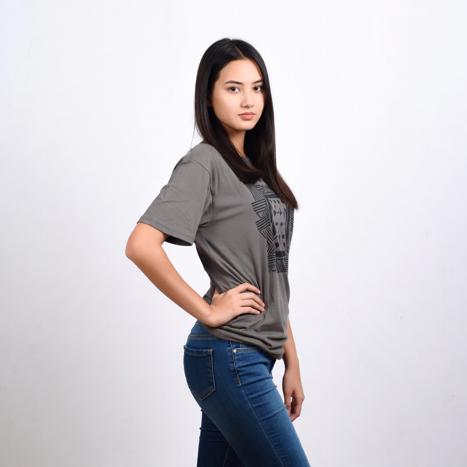 Asian woman posing in gray t-shirt jeans Asian woman posing in gray t-shirt jeans