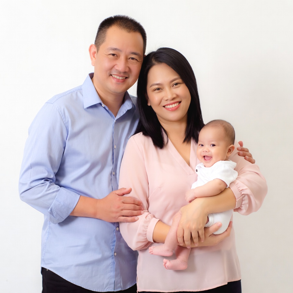 Asian family with smiling baby Asian family with smiling baby