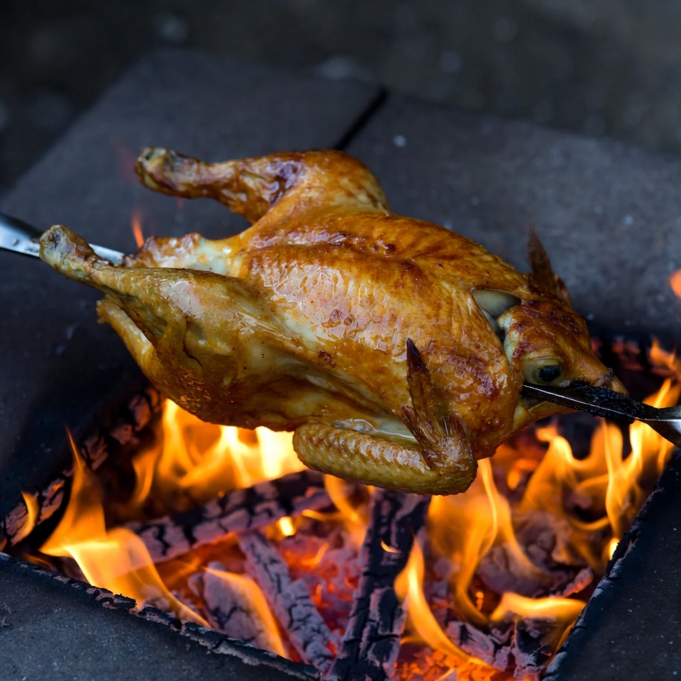 Roast Chicken on Spit over Fire Roast Chicken on Spit over Fire