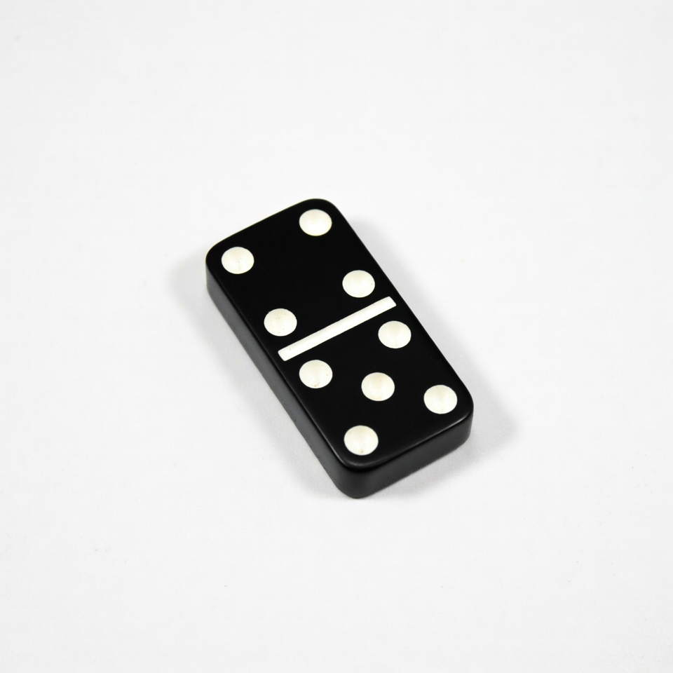 Black domino tile with six dots Black domino tile with six dots