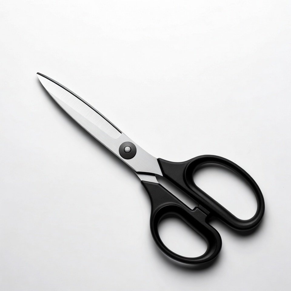 Black handled scissors on white background Black handled scissors on white background