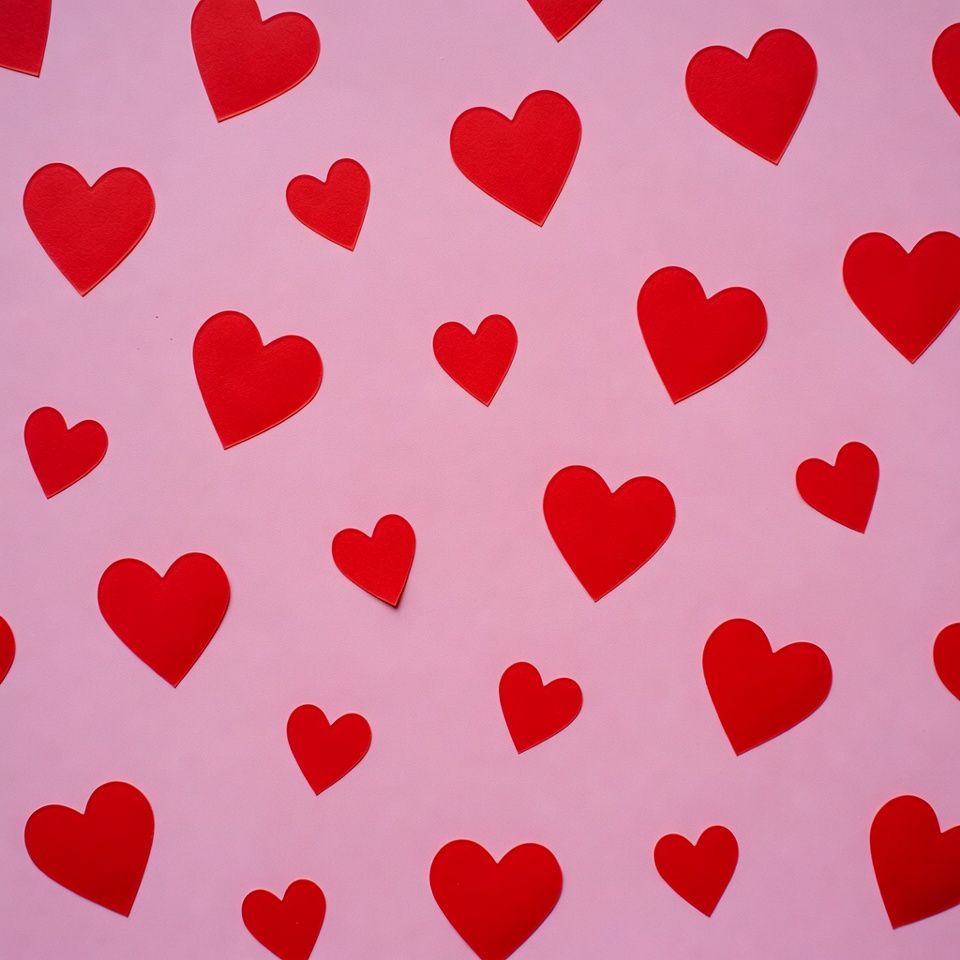 Red hearts on pink background Red hearts on pink background