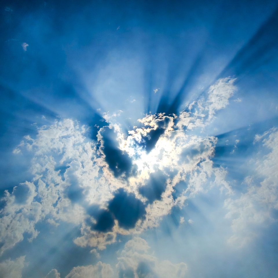 Sun rays bursting through clouds Sun rays bursting through clouds