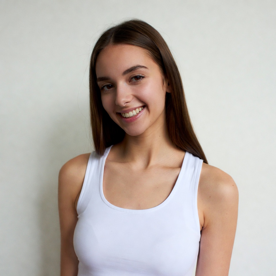 Smiling young woman in white tank top Smiling young woman in white tank top