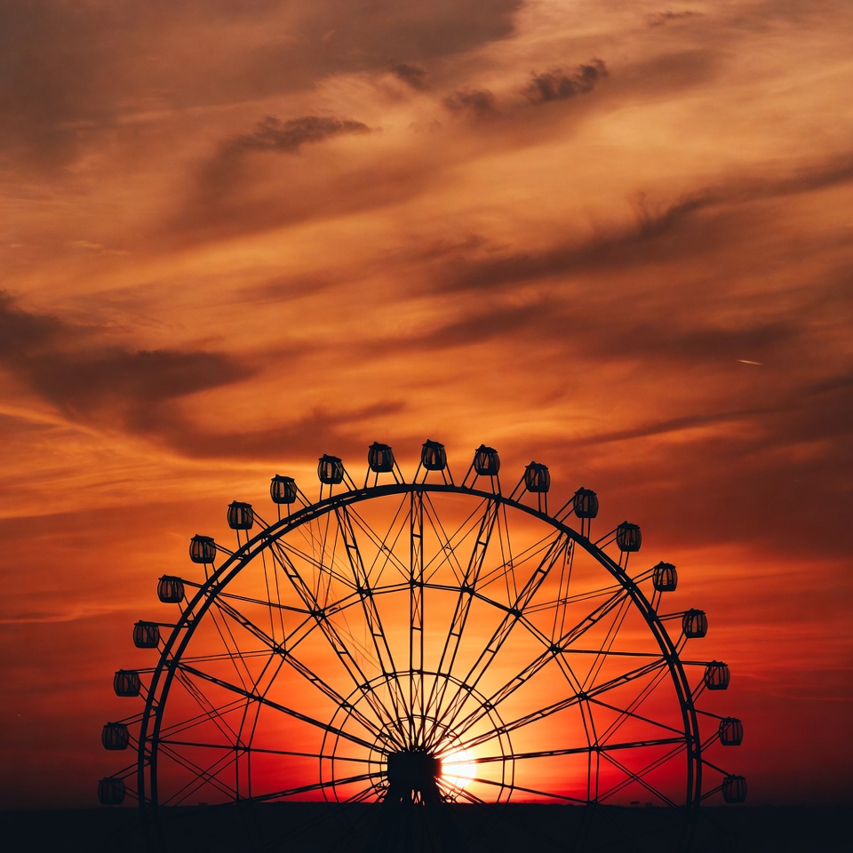 Ferris wheel silhouette at sunset Ferris wheel silhouette at sunset