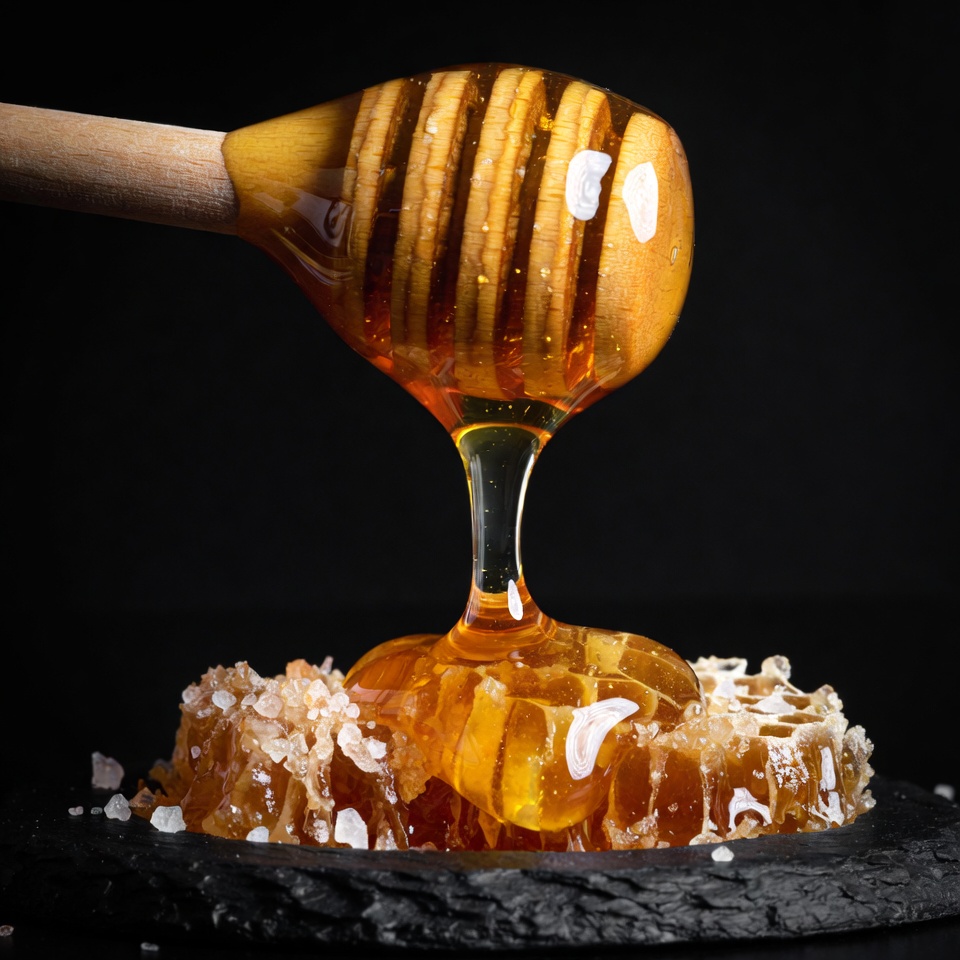 Honey Dripping from Wooden Spoon Honey Dripping from Wooden Spoon