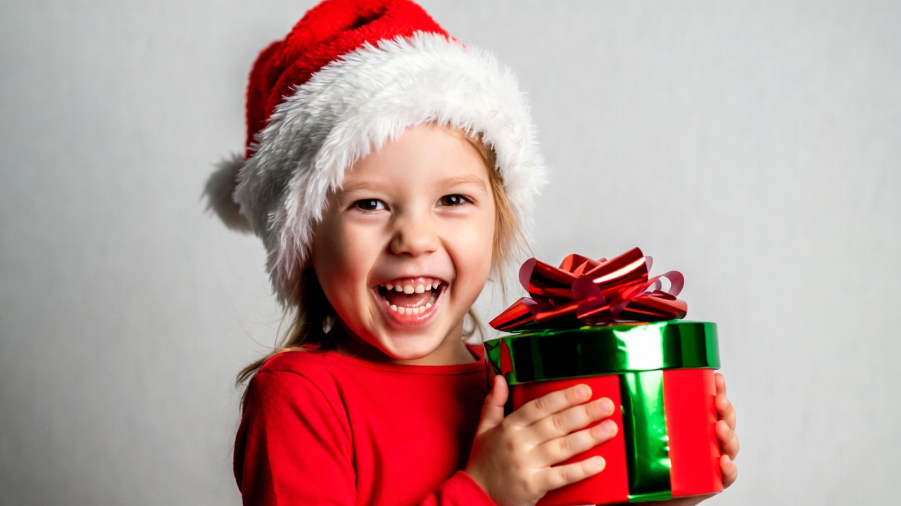 Girl holding Christmas gift Girl holding Christmas gift