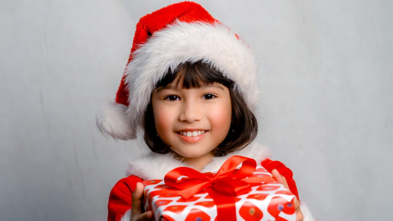 Asian girl holding Christmas gift Asian girl holding Christmas gift