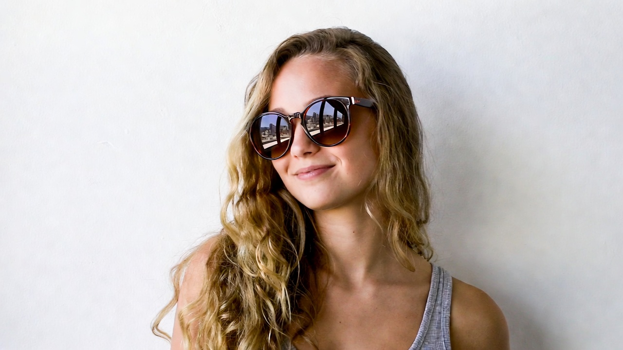 Smiling woman with sunglasses Smiling woman with sunglasses