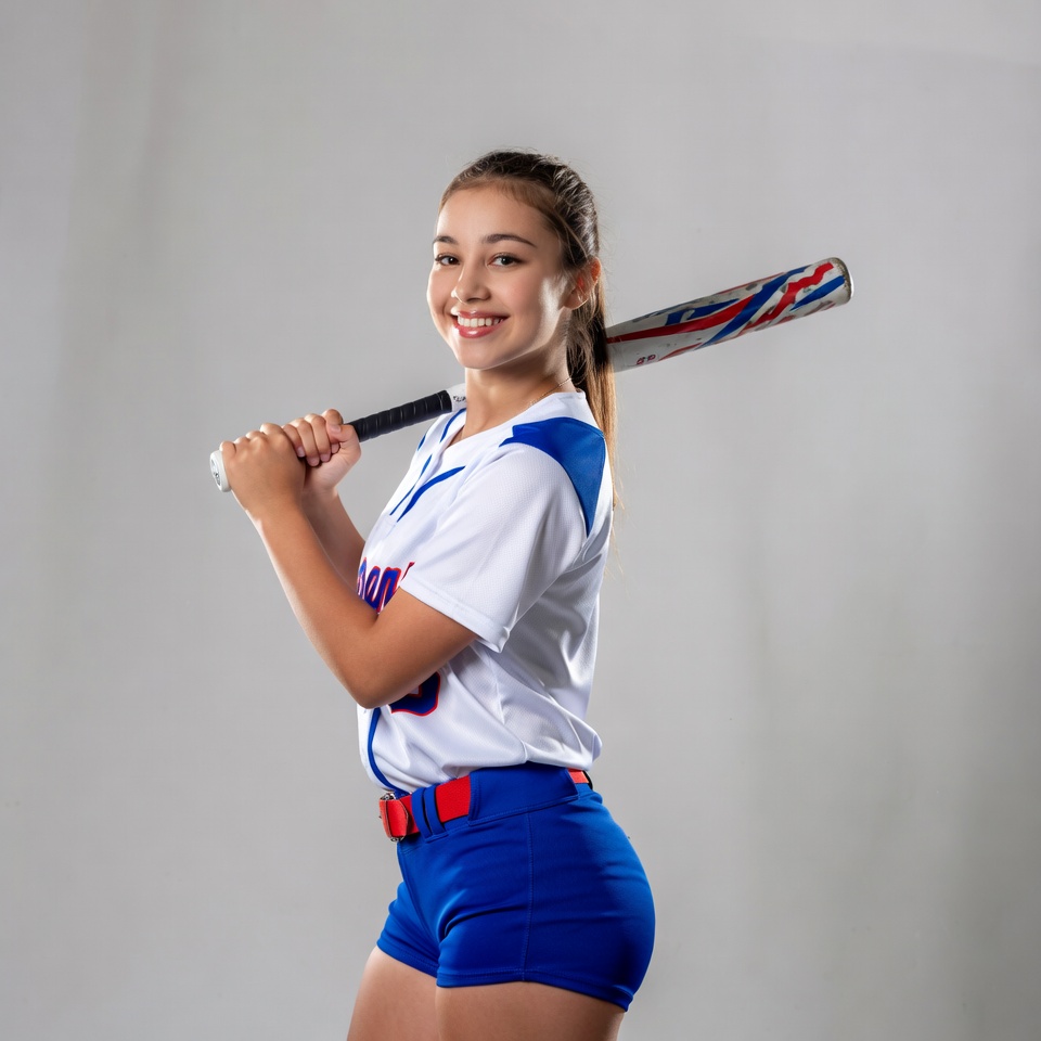 Teen girl holding baseball bat Teen girl holding baseball bat