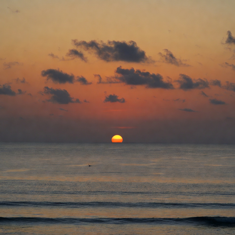 Sunset over ocean waves Sunset over ocean waves