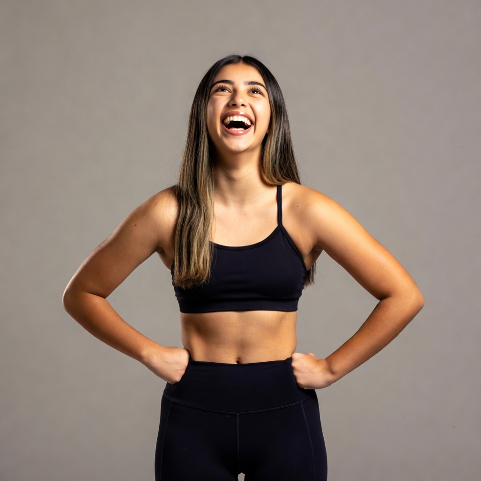 Smiling Latina woman in black workout clothes Smiling Latina woman in black workout clothes
