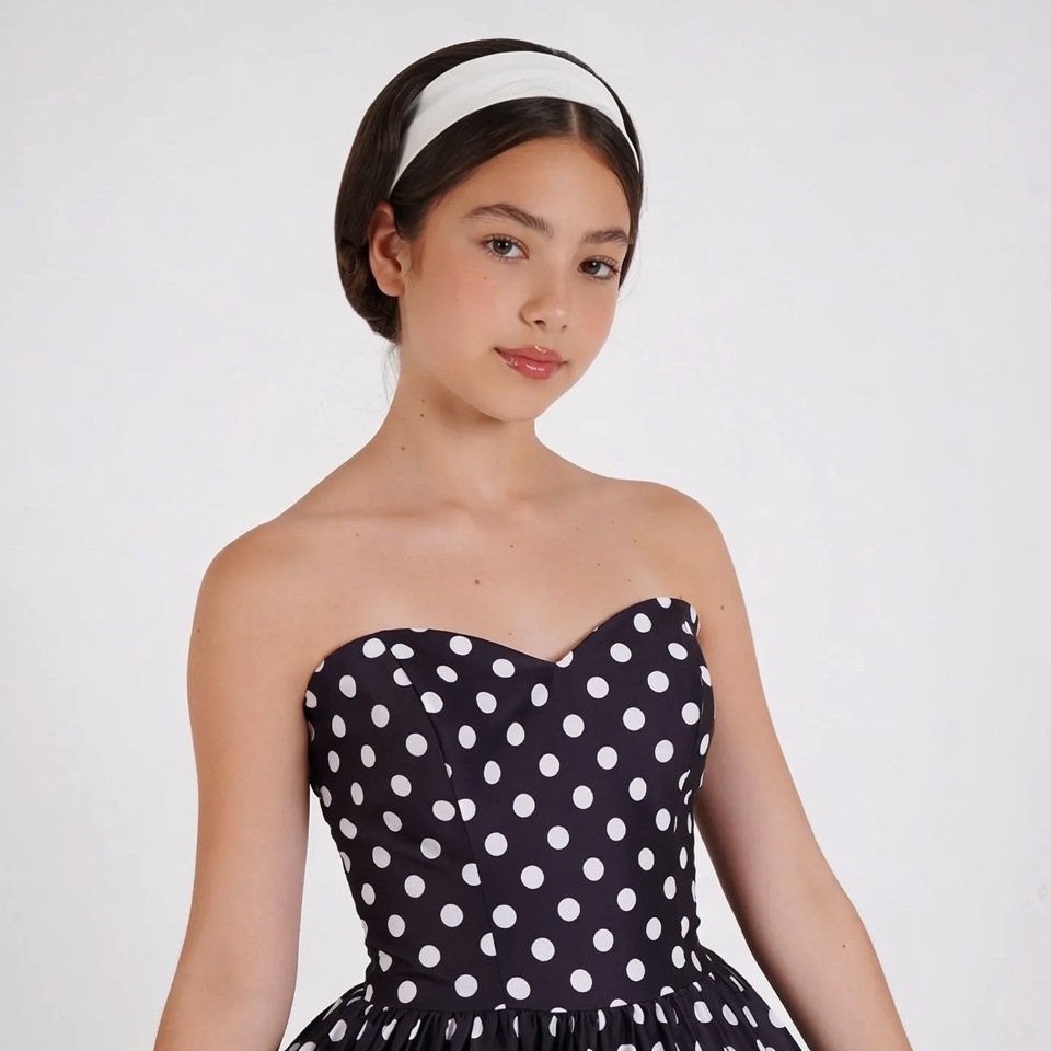 Girl in polka dot strapless dress Girl in polka dot strapless dress