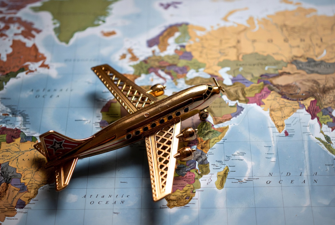 Golden Toy Airplane on World Map Golden Toy Airplane on World Map
