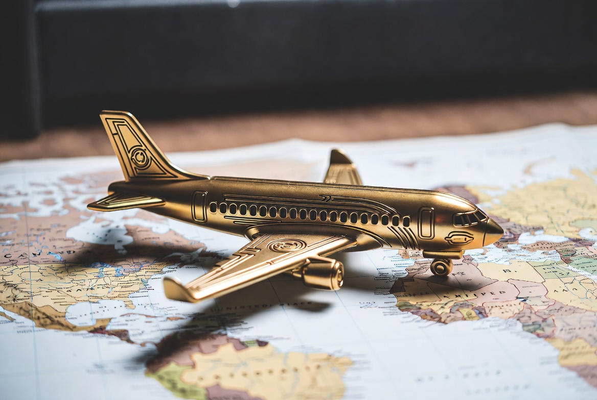 Golden Toy Airplane on World Map Golden Toy Airplane on World Map
