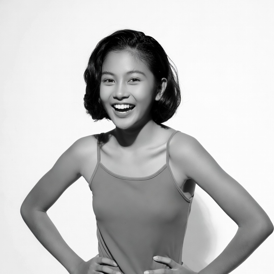 Asian girl smiling with hands on hips Asian girl smiling with hands on hips