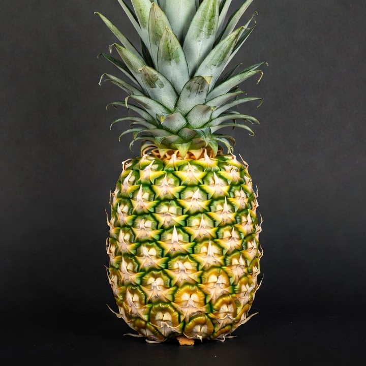 Fresh Pineapple on Black Background Fresh Pineapple on Black Background