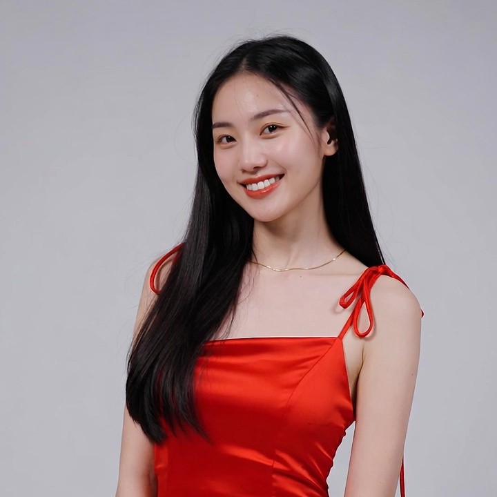 Asian woman in red spaghetti strap dress Asian woman in red spaghetti strap dress