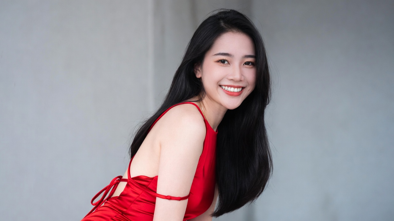 Asian woman in red dress smiling Asian woman in red dress smiling
