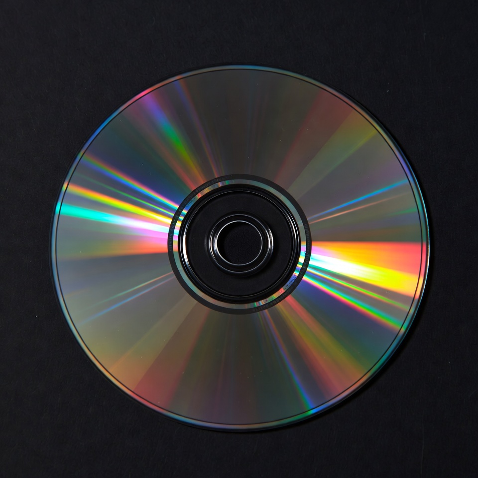 Shiny CD Disc on Black Background Shiny CD Disc on Black Background