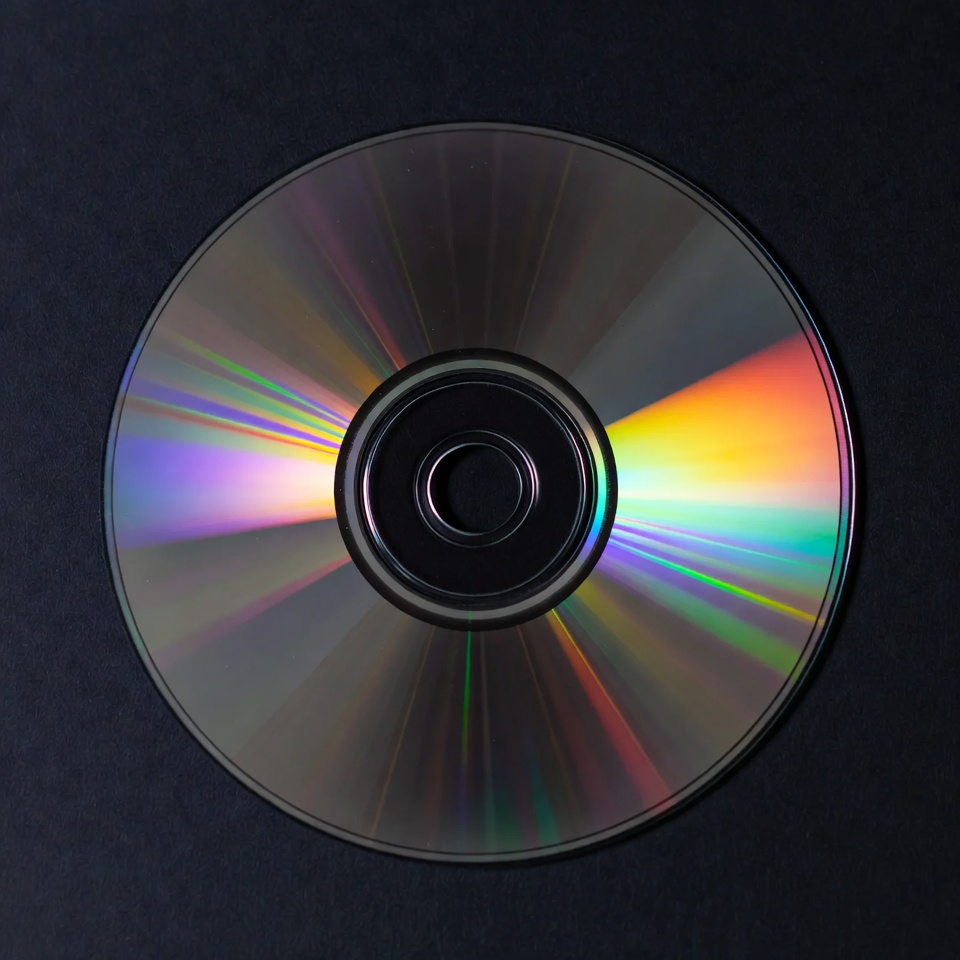 Shiny CD Disc on Black Background Shiny CD Disc on Black Background