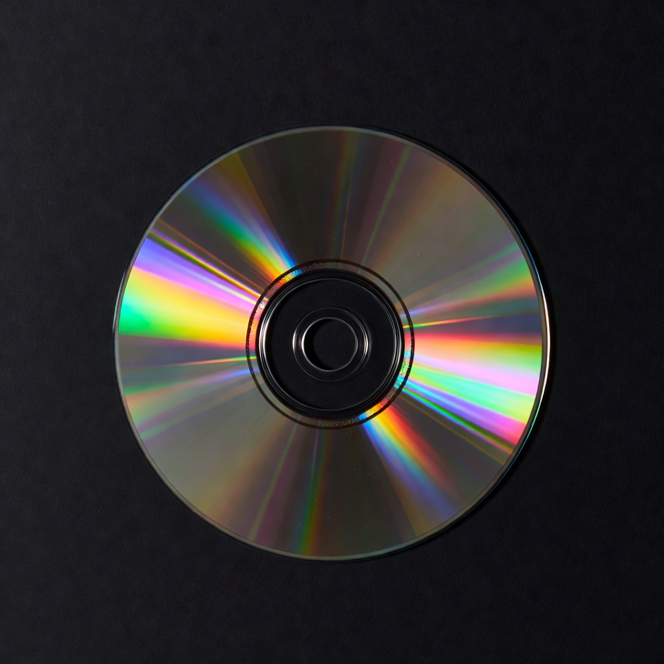 Shiny CD Disc on Black Background Shiny CD Disc on Black Background