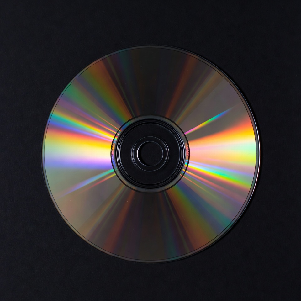Shiny CD Disc on Black Background Shiny CD Disc on Black Background