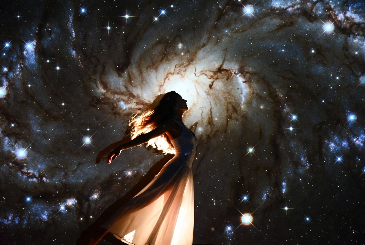 Woman silhouette in cosmic galaxy Woman silhouette in cosmic galaxy