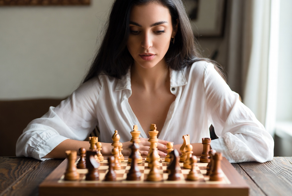 Woman playing chess game Woman playing chess game
