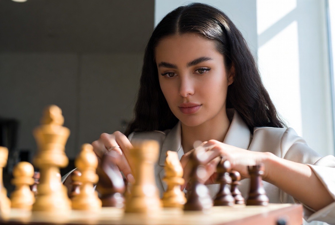 Woman playing chess game Woman playing chess game