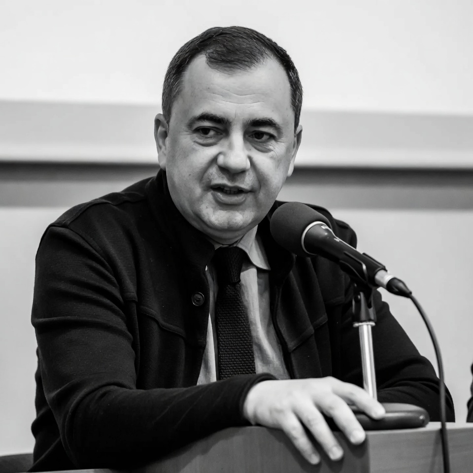 Man speaking at podium Man speaking at podium