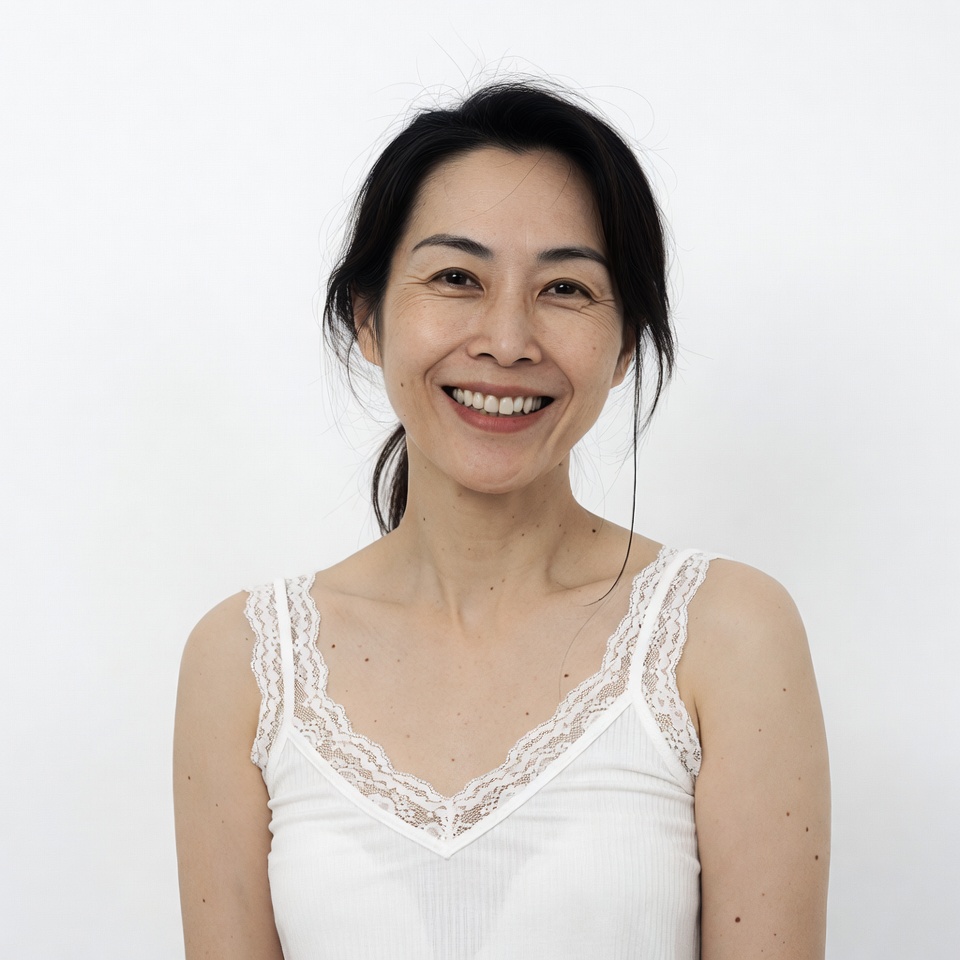 Asian woman smiling in white lace top Asian woman smiling in white lace top