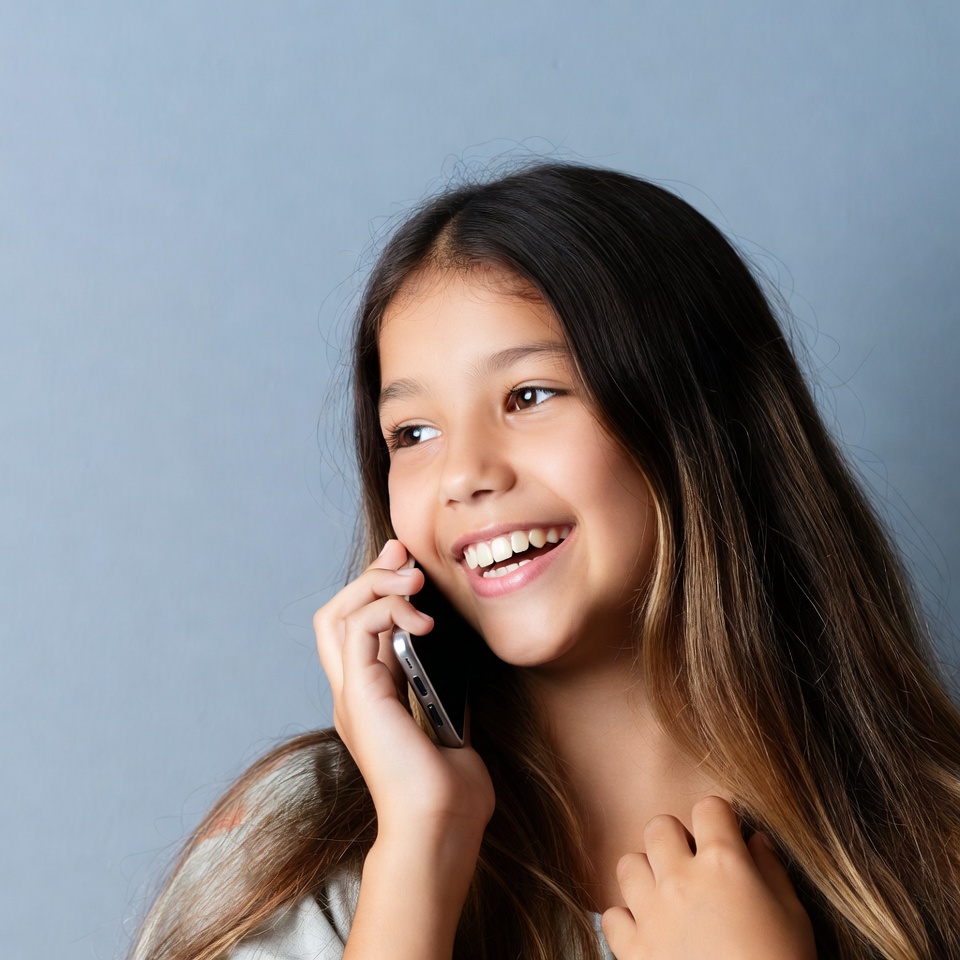 Happy Asian girl talking on phone Happy Asian girl talking on phone