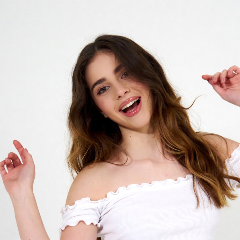 Teen girl smiling with hands raised Teen girl smiling with hands raised