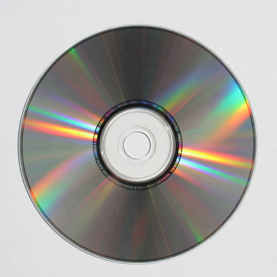 Shiny CD Disc on White Background Shiny CD Disc on White Background