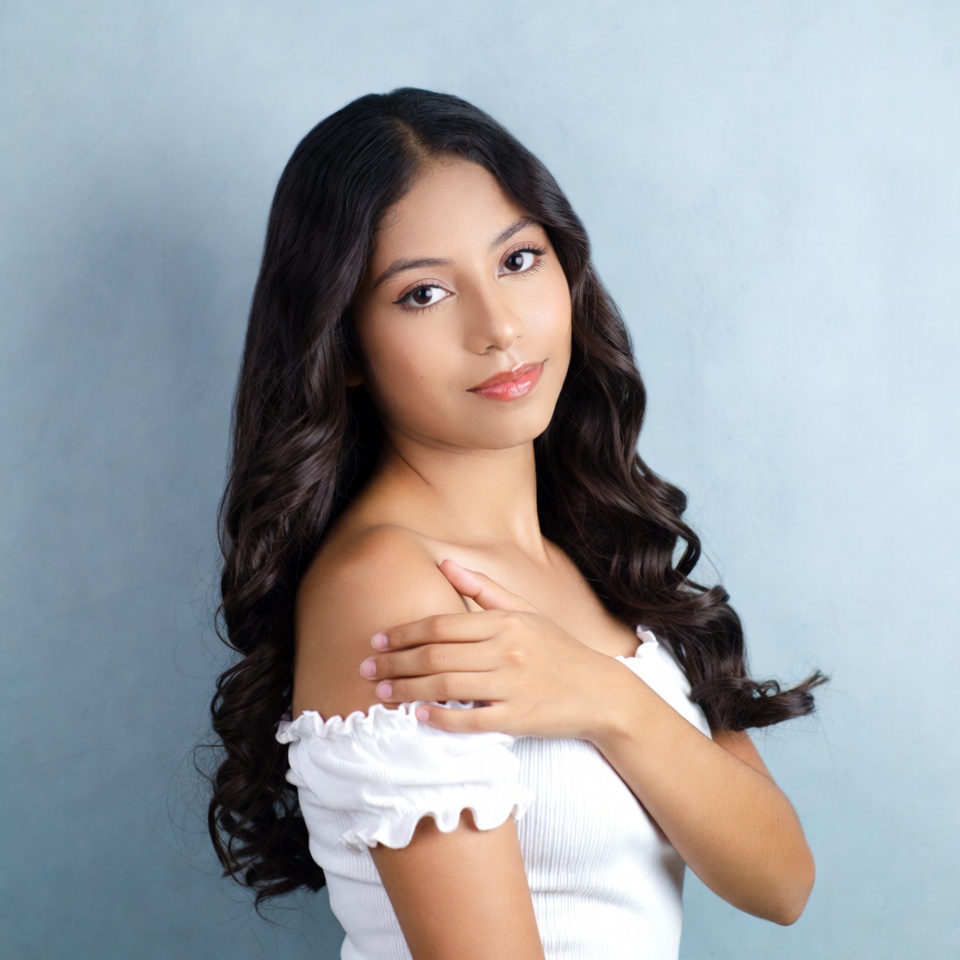 Young Latina woman in off-shoulder top Young Latina woman in off-shoulder top