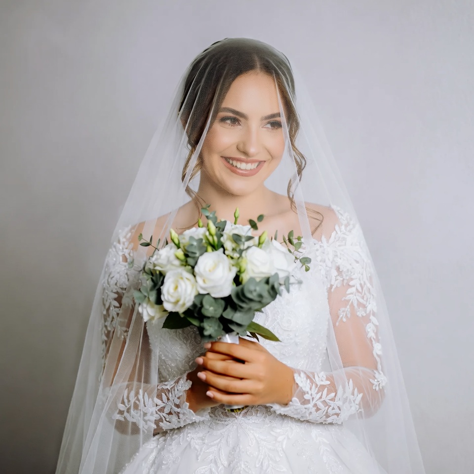 Bride holding white bouquet veil Bride holding white bouquet veil