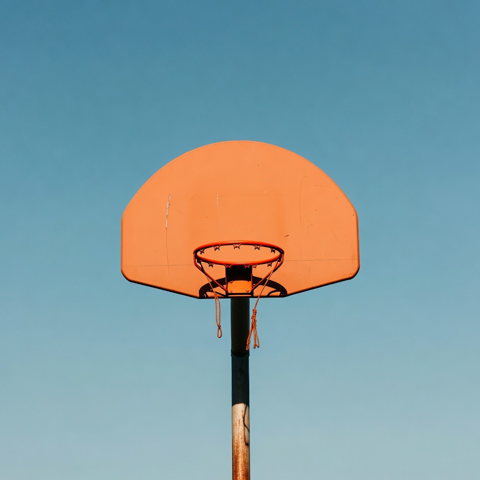 Orange Basketball Hoop on Blue Sky Orange Basketball Hoop on Blue Sky