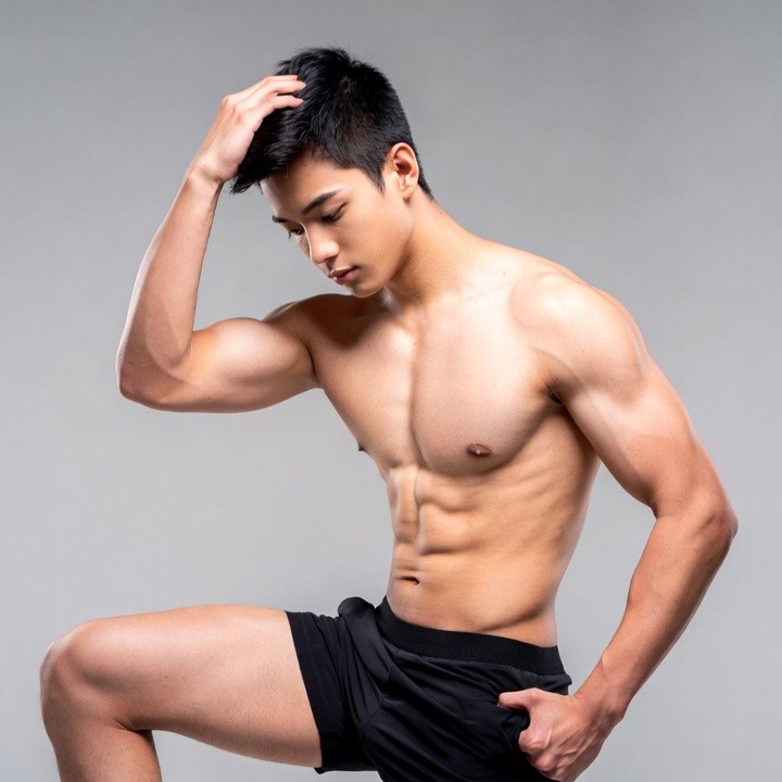 Muscular Asian man posing shirtless Muscular Asian man posing shirtless
