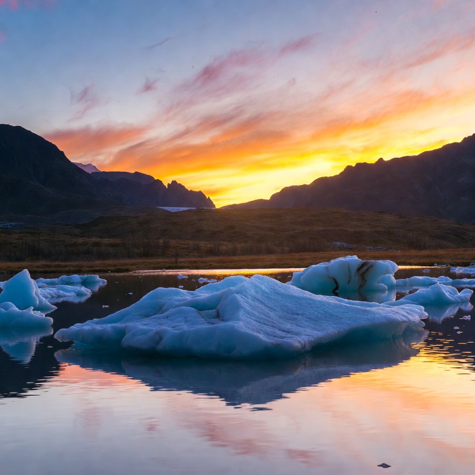 Icebergs in sunset mountain lake Icebergs in sunset mountain lake