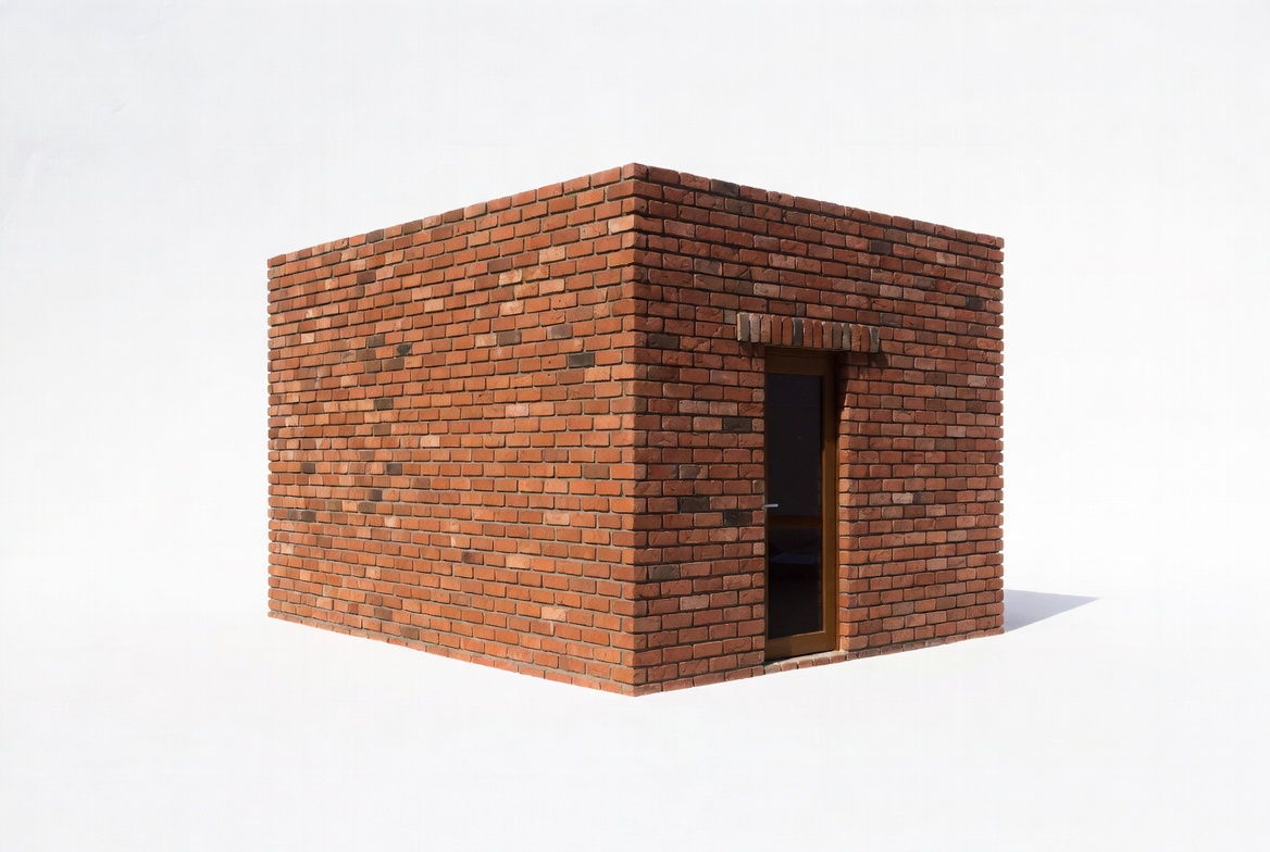 Brick cube building with door Brick cube building with door