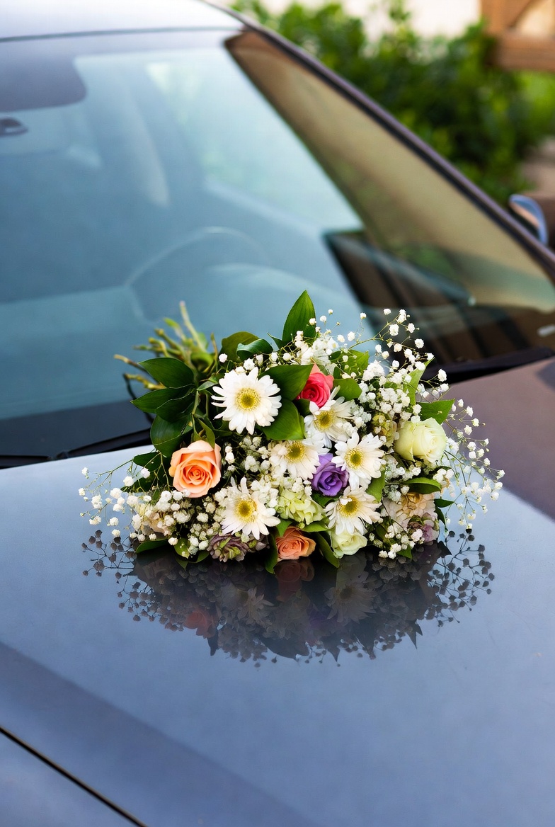 Wedding bouquet on car hood Wedding bouquet on car hood