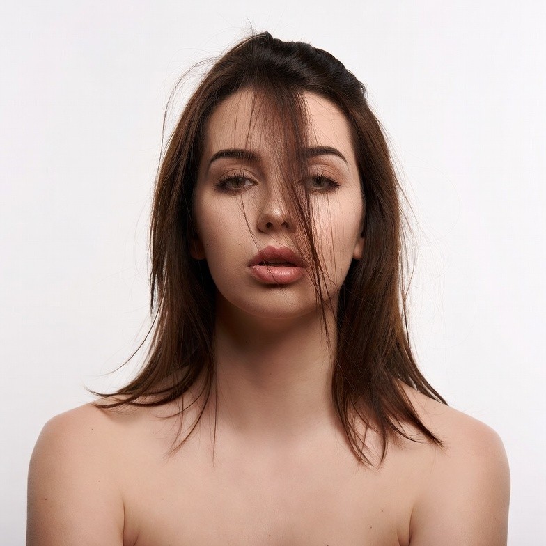 Nude woman with messy brown hair Nude woman with messy brown hair