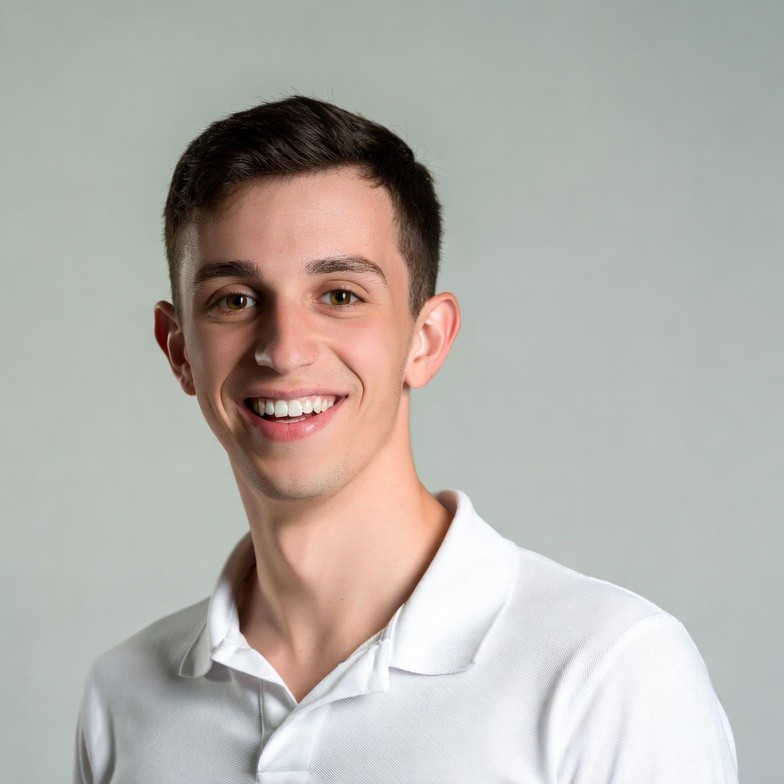 Smiling young man in white polo Smiling young man in white polo