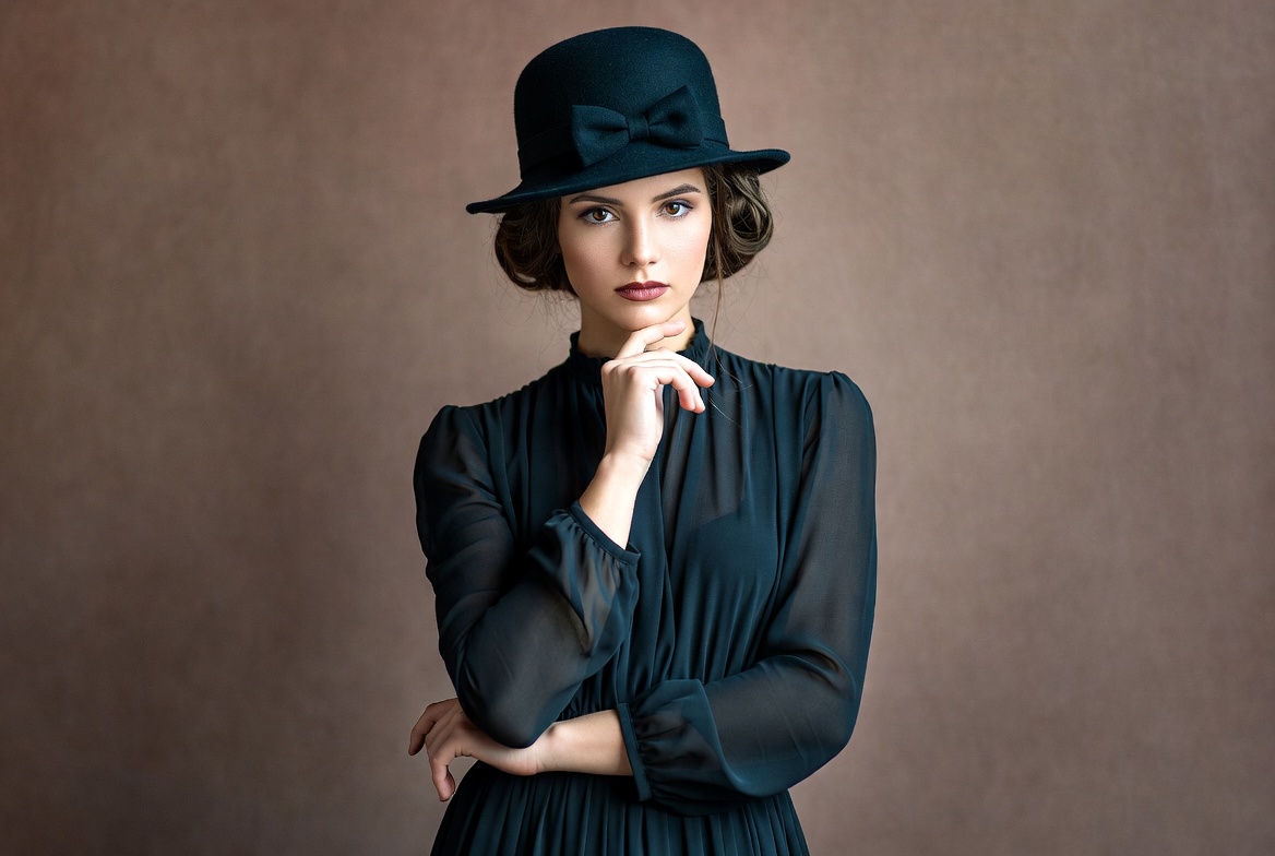 Woman in black hat and dress Woman in black hat and dress