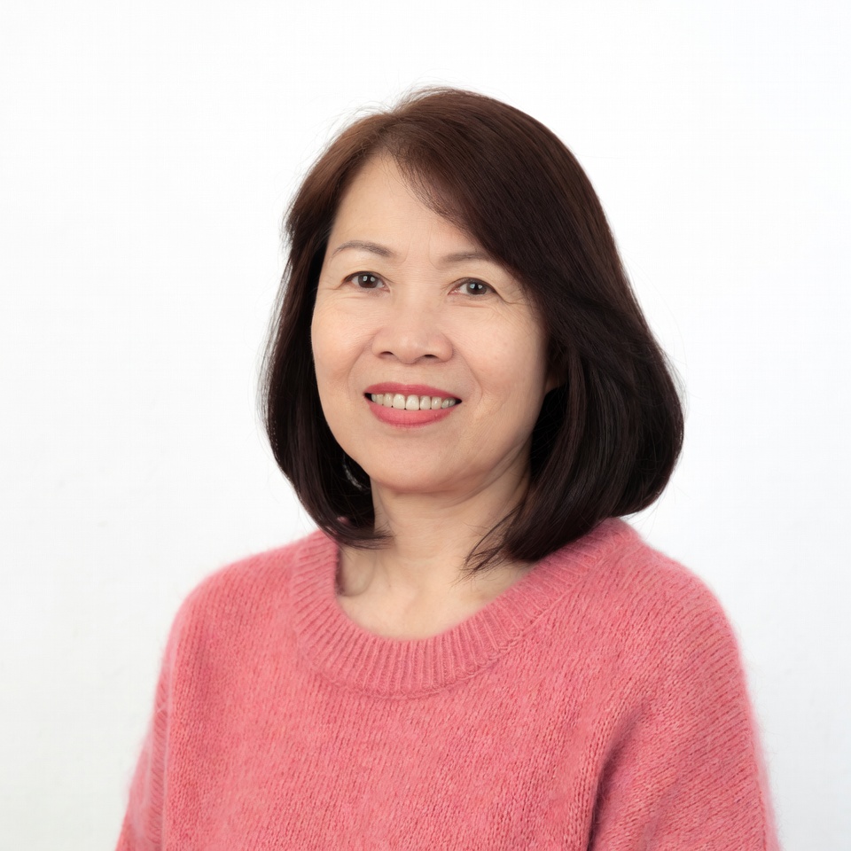 Asian woman smiling in pink sweater Asian woman smiling in pink sweater