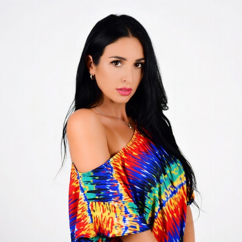 Woman in colorful off-shoulder top Woman in colorful off-shoulder top